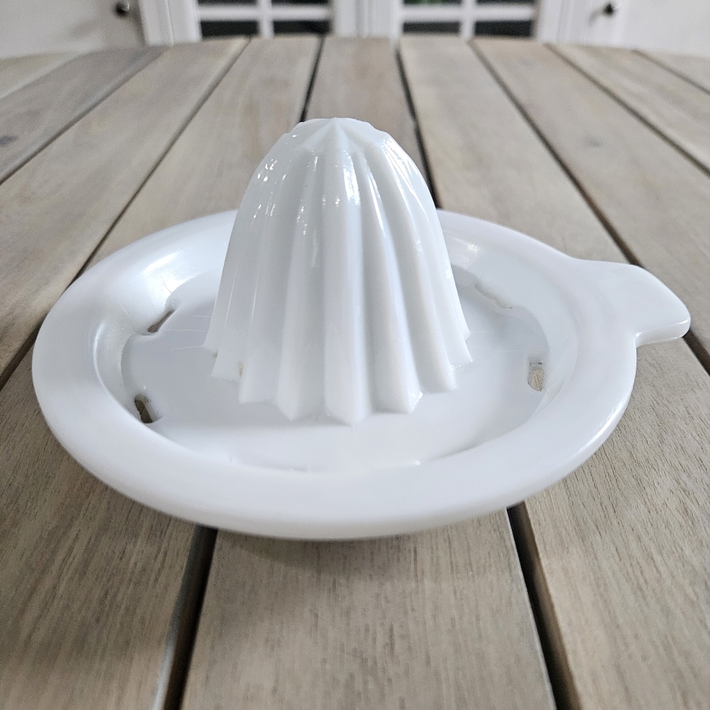 VINTAGE Vitrock milk glass citrus juicer characterized by its ridged cone.